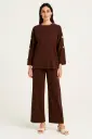 Oversized , long-sleeve Co ords with wide-legged pants & metallic buttons details